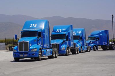 Blue Semis in a Line Being Likely Being Repossesed